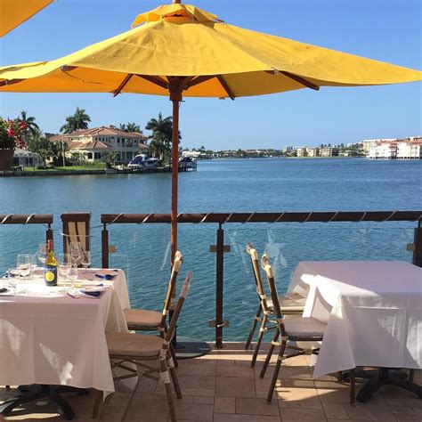 Perfect views of the sunset over Venetian Bay with. . Restaurants in venetian village naples fl